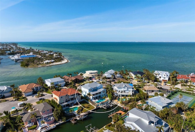 birds eye view of property featuring a water view and a residential view