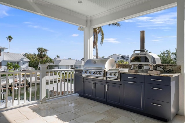 718 Key Royale Dr, Holmes Beach, FL 34217 - view of patio / terrace featuring exterior kitchen, a grill, and a residential view