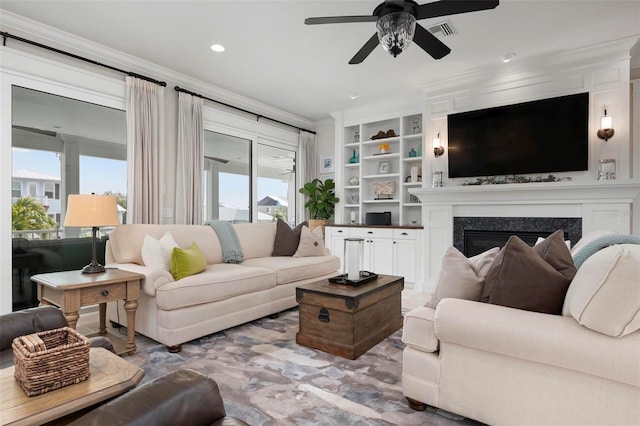 718 Key Royale Dr, Holmes Beach, FL 34217 - living area with plenty of natural light, ceiling fan, a fireplace, crown molding, and recessed lighting