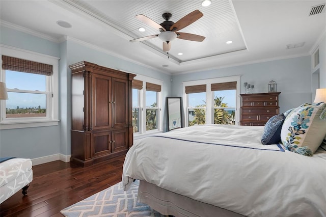 718 Key Royale Dr, Holmes Beach, FL 34217 - bedroom featuring baseboards, dark wood finished floors, a tray ceiling, ceiling fan, and crown molding
