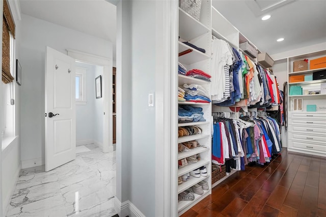718 Key Royale Dr, Holmes Beach, FL 34217 - spacious closet featuring attic access and marble look tiles