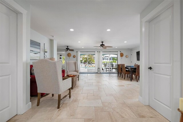 718 Key Royale Dr, Holmes Beach, FL 34217 - corridor featuring stone tile flooring, recessed lighting, and baseboards