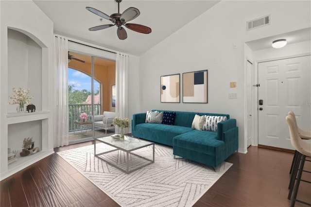 living room featuring vaulted ceiling, dark wood-type flooring, and ceiling fan