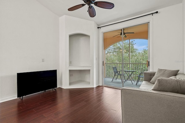 living room featuring ceiling fan and wood-type flooring