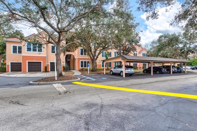 view of parking / parking lot with a garage