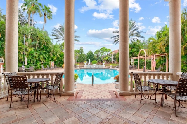 view of swimming pool with a patio