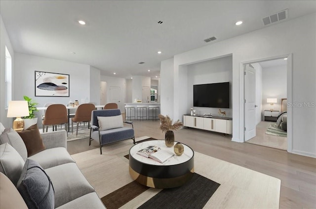 living room with light hardwood / wood-style floors