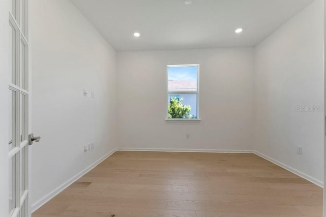 unfurnished room featuring light hardwood / wood-style flooring