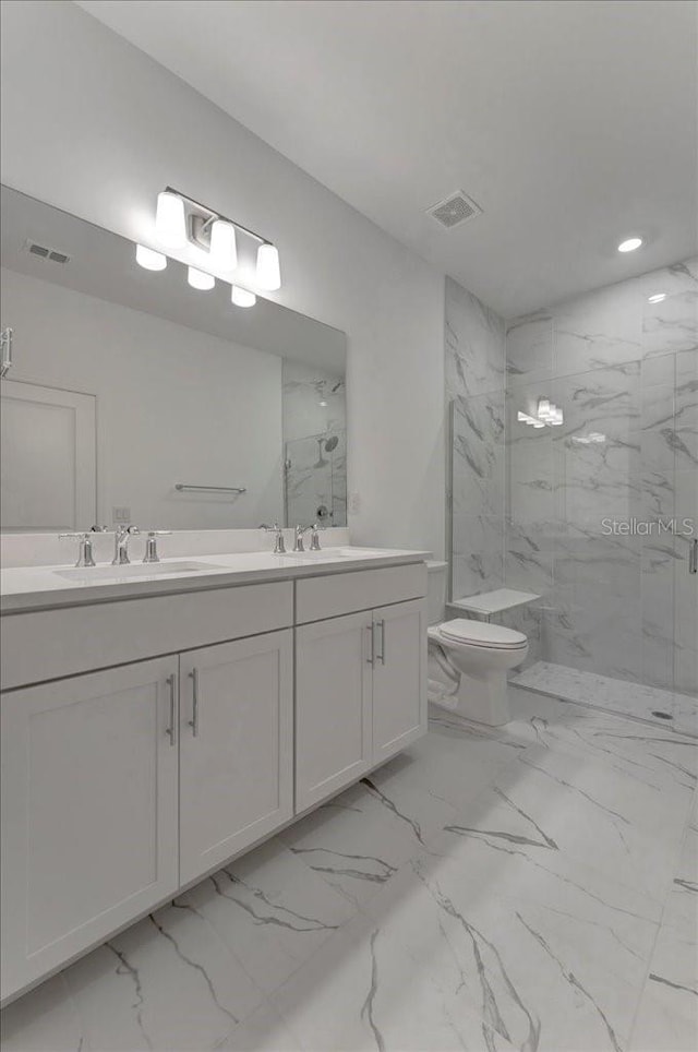 bathroom featuring walk in shower, vanity, and toilet