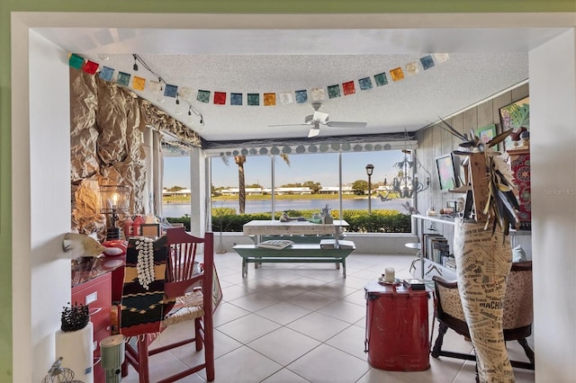 interior space featuring ceiling fan