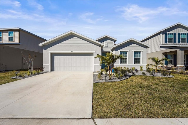 view of front facade featuring a garage, concrete driveway, a front lawn, and stucco siding