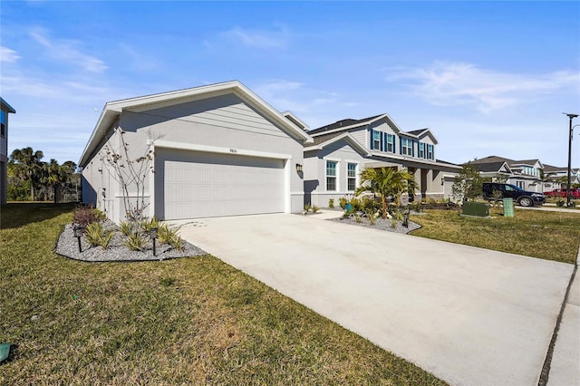 view of front of house with a garage and a front yard