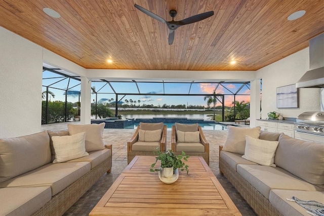 living room with ceiling fan, wooden ceiling, and a water view