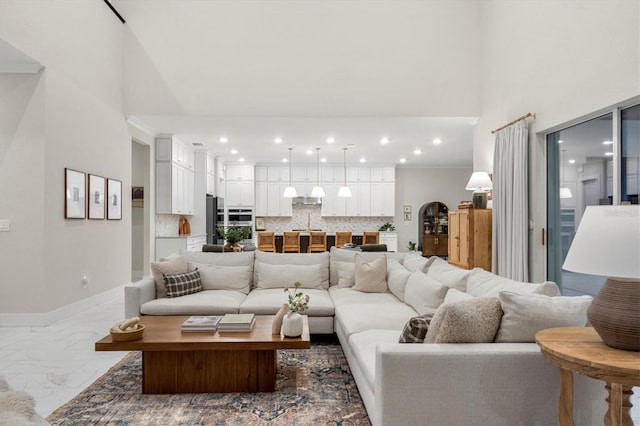 living room featuring a high ceiling