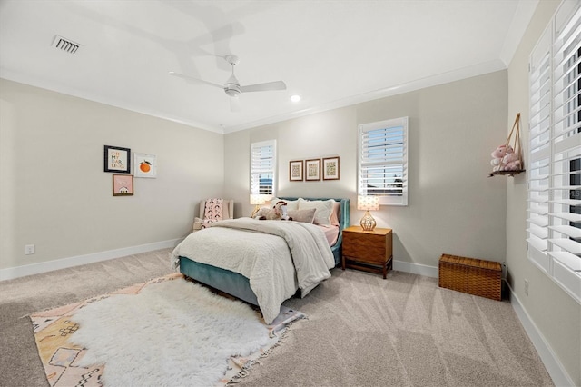 bedroom featuring light colored carpet, ceiling fan, and ornamental molding