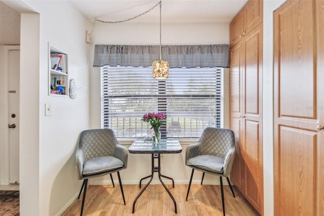 living area with light hardwood / wood-style flooring