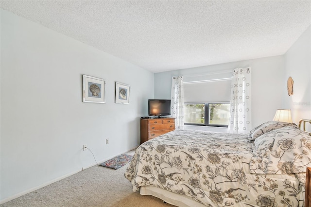 carpeted bedroom with a textured ceiling