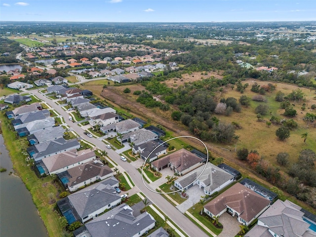 drone / aerial view featuring a water view