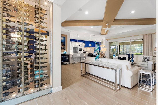 living room with wine cooler, coffered ceiling, and beam ceiling