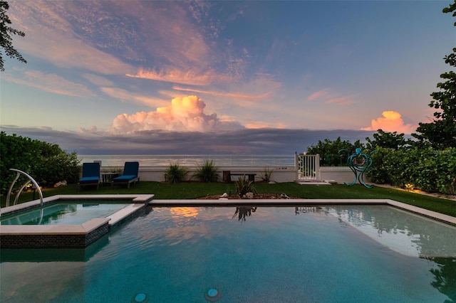 915 N Shore Dr, Anna Maria, FL 34216 - view of pool with a pool with connected hot tub and fence