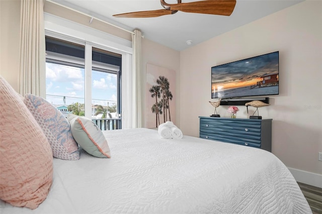 915 N Shore Dr, Anna Maria, FL 34216 - bedroom with baseboards, ceiling fan, wood finished floors, and access to exterior