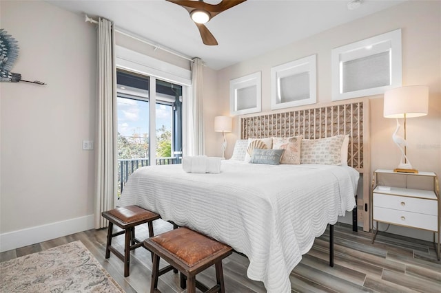 915 N Shore Dr, Anna Maria, FL 34216 - bedroom featuring baseboards, access to outside, a ceiling fan, and wood finished floors