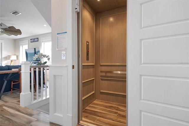 915 N Shore Dr, Anna Maria, FL 34216 - room details with a ceiling fan, visible vents, wood finished floors, elevator, and recessed lighting