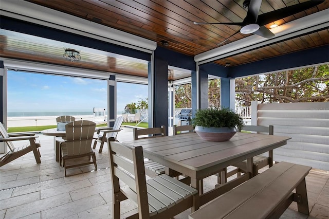 915 N Shore Dr, Anna Maria, FL 34216 - view of patio / terrace featuring a ceiling fan, outdoor dining space, and a water view
