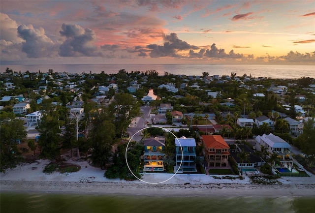 915 N Shore Dr, Anna Maria, FL 34216 - aerial view at dusk with a beach view, a water view, and a residential view