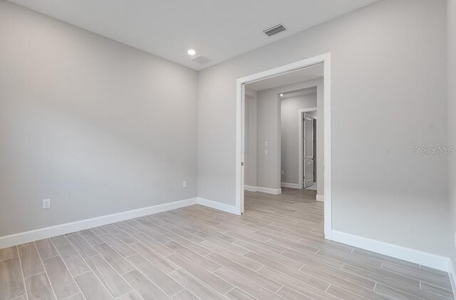8024 Moonbeam Ave, Sarasota, FL 34241 - unfurnished room featuring baseboards, light wood-type flooring, and recessed lighting