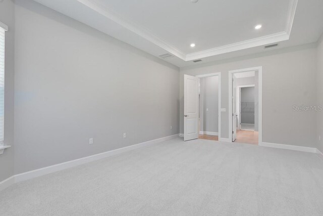 8024 Moonbeam Ave, Sarasota, FL 34241 - unfurnished bedroom featuring a raised ceiling, light colored carpet, ornamental molding, baseboards, and recessed lighting