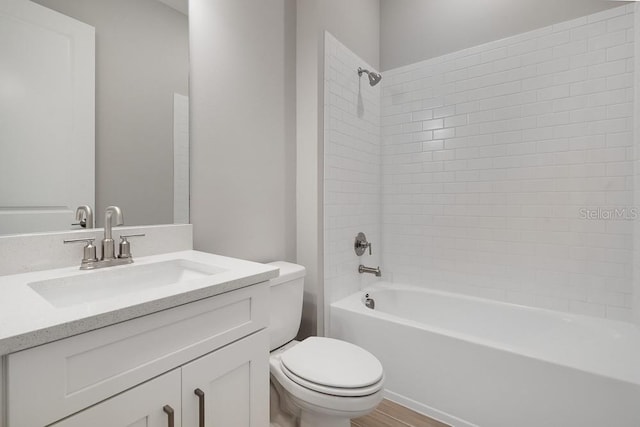 8024 Moonbeam Ave, Sarasota, FL 34241 - bathroom with toilet, vanity, bathtub / shower combination, and wood finished floors