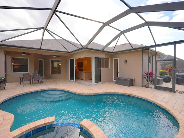 view of pool featuring ceiling fan, a lanai, and a patio