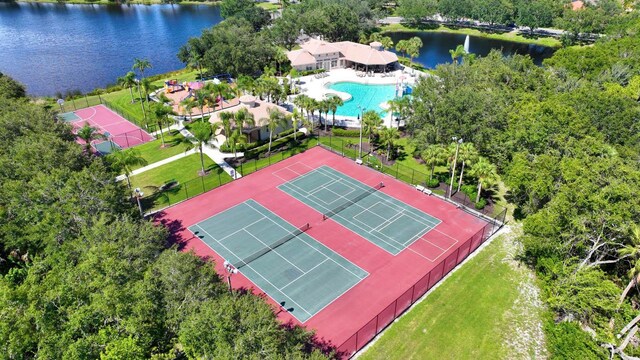 birds eye view of property with a water view