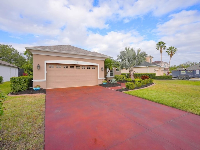 view of front of home featuring a garage and a front lawn