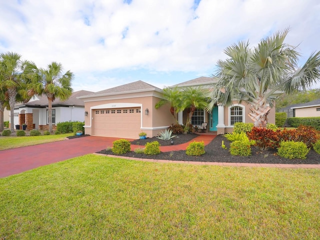 single story home with a garage and a front lawn