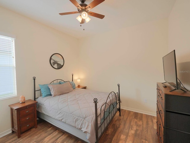 bedroom featuring ceiling fan and dark hardwood / wood-style floors