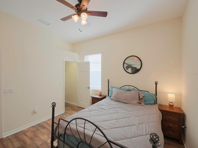 bedroom with ceiling fan and hardwood / wood-style floors