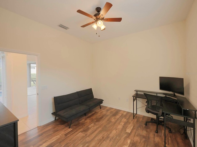 office area featuring ceiling fan and dark wood-type flooring