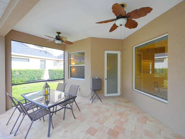 sunroom / solarium with ceiling fan