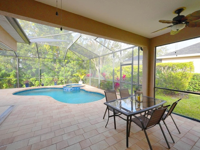 view of swimming pool with an in ground hot tub, a patio area, and glass enclosure