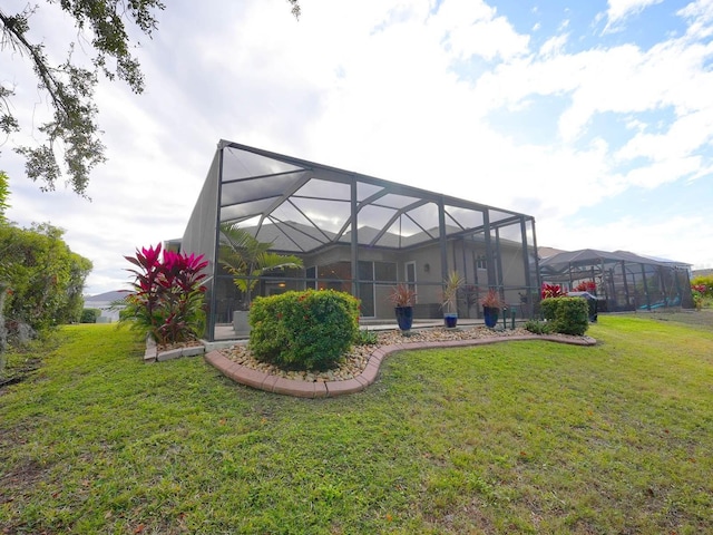 view of yard featuring glass enclosure