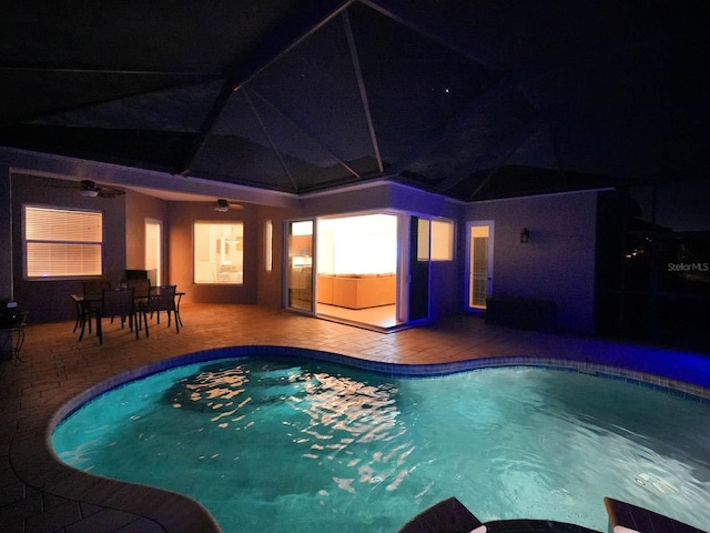 view of pool with a patio area and ceiling fan