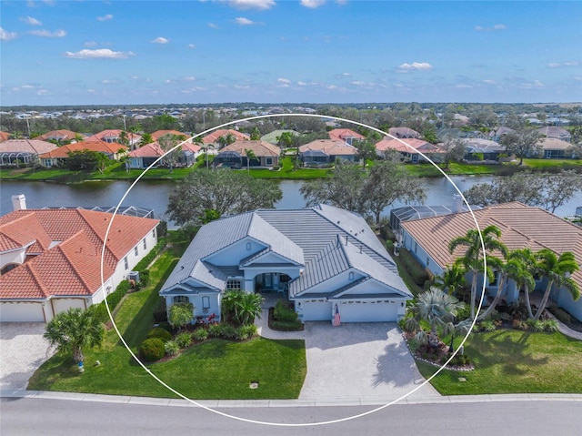 birds eye view of property featuring a water view