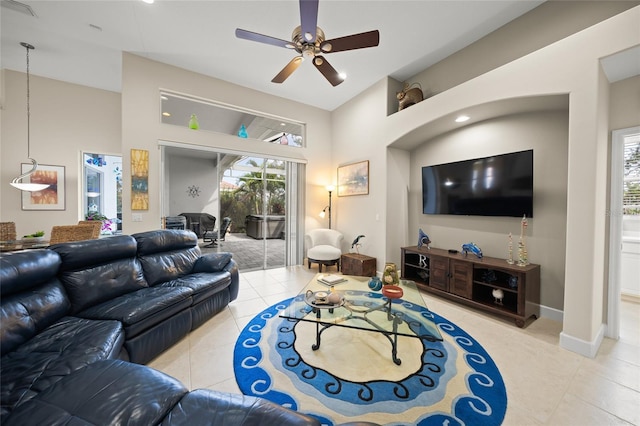 tiled living room featuring ceiling fan