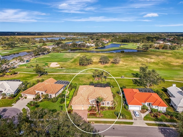 aerial view featuring a residential view, view of golf course, and a water view