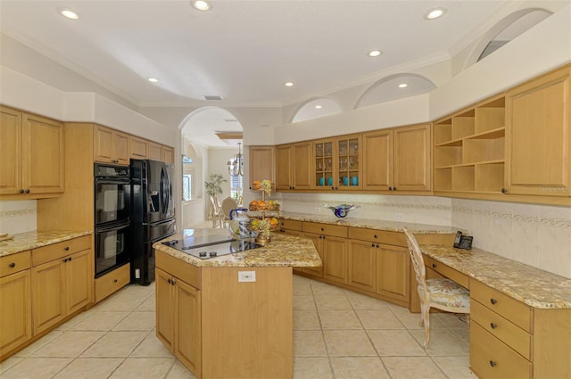 kitchen with arched walkways, light tile patterned flooring, a kitchen island, and black appliances