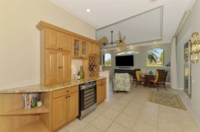 kitchen with open shelves, open floor plan, light tile patterned flooring, light stone countertops, and beverage cooler