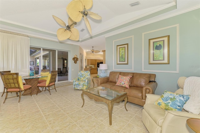 living area featuring ornamental molding, light tile patterned flooring, visible vents, and a ceiling fan