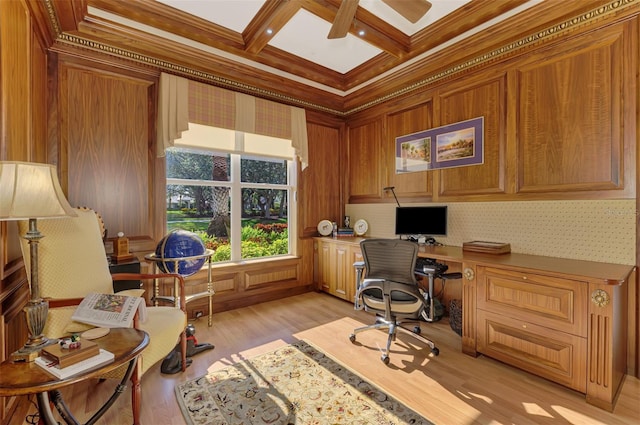 office area with crown molding, built in study area, light wood-type flooring, coffered ceiling, and beamed ceiling